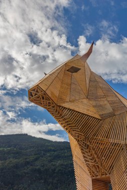 Mollis, Switzerland - August 29. 2025: The big wooden cow (21 meter hight)  at the Swiss Wrestling and Alpine Festival, which is the most traditional national sport festival held every three year in Switzerland