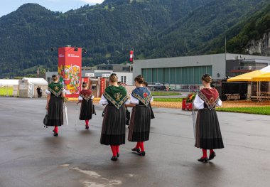 Mollis, Switzerland - August 29. 2025: A group of young women in traditional dirndl costume at the the Swiss Wrestling and Alpine Festival