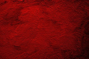 Yakından fırça darbeleriyle kaplanmış sert kırmızı duvarlar.