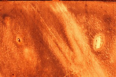 Sıcak portakallı, eski, pürüzlü bir duvar.