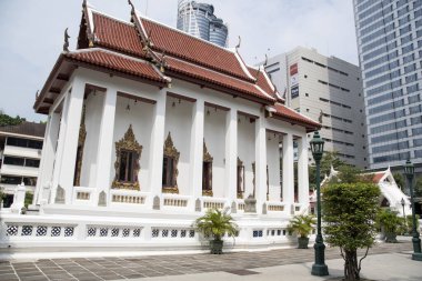 Bangkok, Thailand- 17 Feb, 2023: Wat Pathum Wanaram Temple is located between the two shopping malls Siam Paragon and CentralWorld, Bangkok. It is also known as the lotus temple.