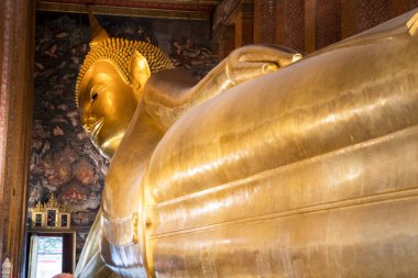 Gigantic Reclining Buddha statue in Wat Pho, Bangkok.  Wat Pho is the oldest and largest temple complex in Bangkok