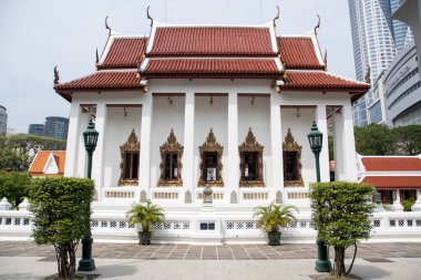Bangkok, Thailand- 17 Feb, 2023: Wat Pathum Wanaram Temple is located between the two shopping malls Siam Paragon and CentralWorld, Bangkok. It is also known as the lotus temple.