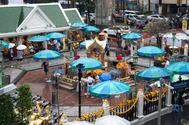 Bangkok, Thailand- 15 Feb, 2023: People visit to Erawan Shrine to pray for luck and fortune. Erawan Shrine is one of the most popular Hindu shrines in downtown Bangkok