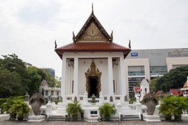 Bangkok, Thailand- 17 Feb, 2023: Wat Pathum Wanaram Temple is located between the two shopping malls Siam Paragon and CentralWorld, Bangkok. It is also known as the lotus temple.