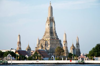 Bangkok, Thailand- 14 Feb, 2023: Wat Arun (The Temple of Dawn) and the Chao Phraya River in Bangkok, Thailand. This landmark of Wat Arun is a 70-meter-high temple tower, a stupa-like pagoda