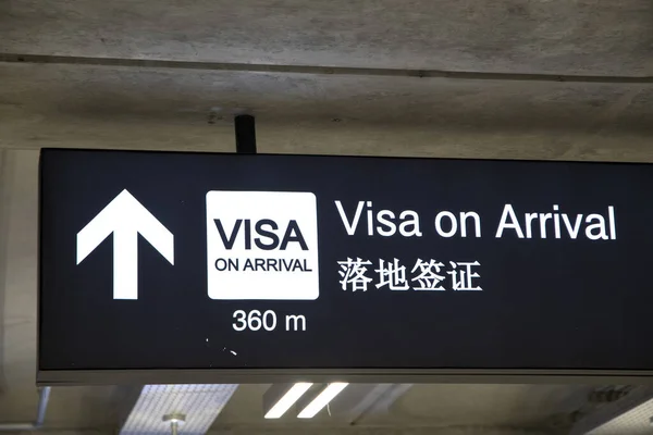 Airport signs for visa on arrival in  English and Chinese langague