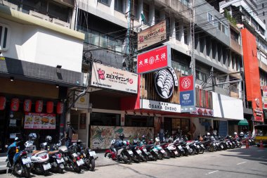 Bangkok, Thailand- 15 Feb, 2023: Various billboards display on the shop along Silom area, Bangkok. Silom area nightlife is most famous for its red light district of Patpong