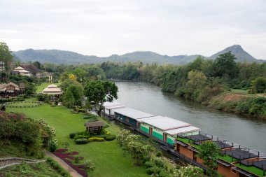 Kanchanaburi, Thailand- 16 Feb, 2023: Resort with floating apartments on the River Kwai in Kanchanaburi, Thailand. It is a serene hideaway surrounded by verdant greenery