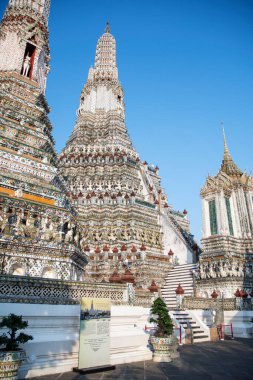 Impressive architectural details of Wat Arun (The Temple of Dawn) in Bangkok. This landmark of Wat Arun is a 70-meter-high temple tower, a stupa-like pagoda