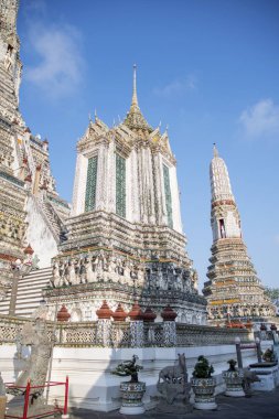 Impressive architectural details of Wat Arun (The Temple of Dawn) in Bangkok. This landmark of Wat Arun is a 70-meter-high temple tower, a stupa-like pagoda