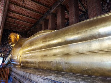 Gigantic Reclining Buddha statue in Wat Pho, Bangkok.  Wat Pho is the oldest and largest temple complex in Bangkok