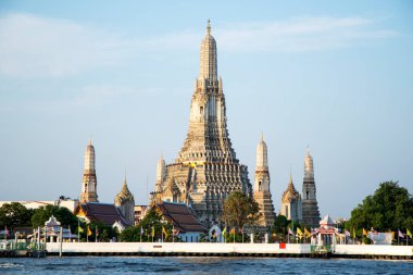 Bangkok, Thailand- 14 Feb, 2023: Wat Arun (The Temple of Dawn) and the Chao Phraya River in Bangkok, Thailand. This landmark of Wat Arun is a 70-meter-high temple tower, a stupa-like pagoda