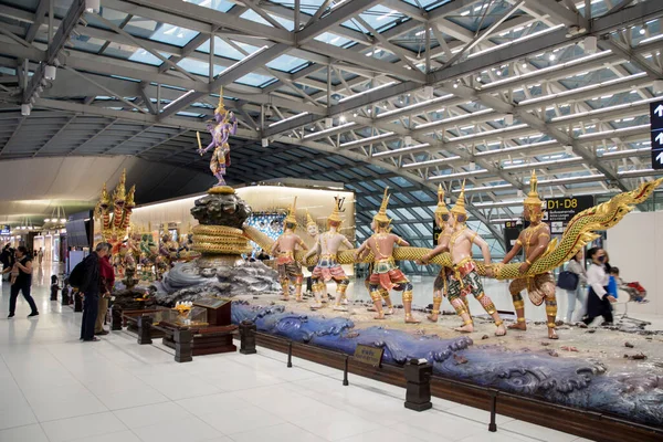 Stock image Bangkok, Thailand- 18 Feb, 2023: Scene of the Yaksha (demigod) Churning of the Milk Ocean sculpture at the duty free zone in Suvanabhumi Airport