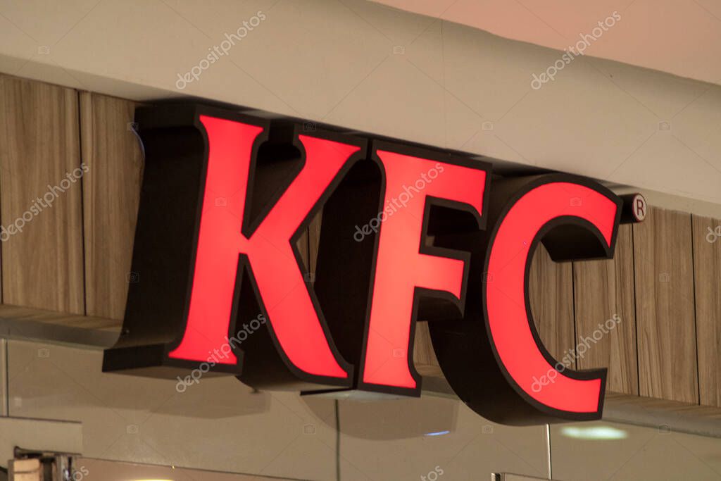 Johor Bahru, Malaysia- 3 Feb, 2023- View of a glowing KFC restaurant sign in shopping mall. It is the world's second-largest restaurant chain