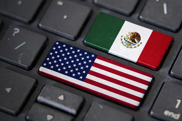 USA and Mexico flags on computer keyboard. Relationship between two countries.