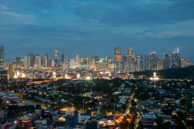 Manila, Philippines-16 Oct 2023: View of Bonifacio Global City Skyline in Manila during the sunset. Bonifacio Global City is now a major urban development and financial district clipart