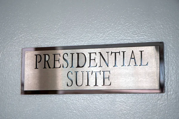 President suit banner on hotel door