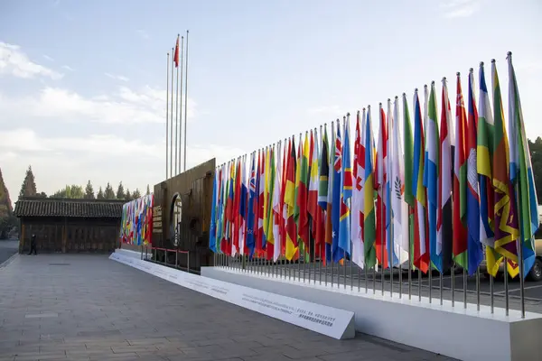 stock image Wuzhen, China- 28 Nov, 2023: Colorful flags of various nations on the poles for the Word Internet Conference in Wuzhen.