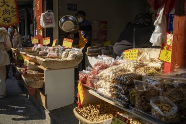 Shanghai, China- 3 Dec, 2023: Local street food and snacks sold at the Xinchang Ancient Town in Shanghai, China. It is a picturesque water town located in the southern outskirts of Shanghai