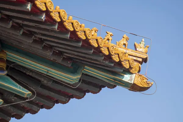 Roof structure of Chinese traditional building against the blue sky