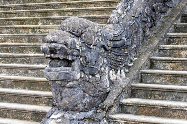Hue, Vietnam- 28 Feb, 2024: Stone dragon statue inside Tomb of Khai Dinh emperor in Hue Vietnam. Khai Dinh was the penultimate emperor of Vietnam, from 1916 to 1925