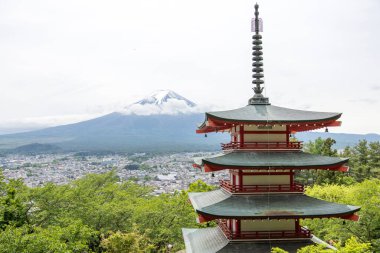 Shimoyoshida, Japan- 15 May 2024: View of mount Fuji with Chureito Pagoda at Arakurayama Sengen Park mountain in Japan clipart