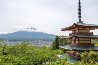 Shimoyoshida, Japan- 15 May 2024: View of mount Fuji with Chureito Pagoda at Arakurayama Sengen Park mountain in Japan clipart