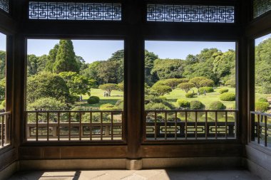 Tokyo, Japan - 17 May 2024: View from Kyu Goryo Tei or Taiwan Pavilion from Shinjuku Gyoen National Garden in Tokyo. The building was a gift from Japanese people in Taiwan clipart