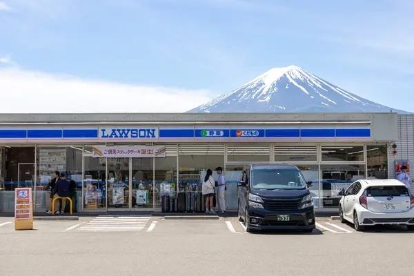 stock image Kawaguchiko , Japan- 15 May 2024: Lawson at Kawaguchiko Station with Mount Fuji in the background.