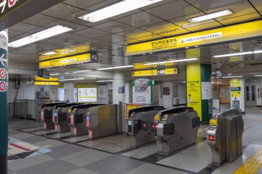 Tokyo, Japan- 11 May, 2024: Entrance and exit gate of subway train in Daimon station, Tokyo. Subway metro is the easier way to travel around Tokyo clipart