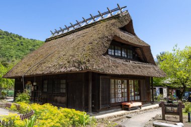Kawaguchiko, Japan- 16 May, 2024: Saiko Iyashi no Sato Nenba or Traditional Japanese Village in Kawaguchiko, Japan. This is a beautiful place to assemble ancient farm houses close to Mount Fuji clipart