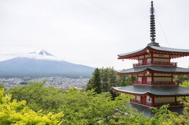 Shimoyoshida, Japan- 15 May 2024: View of mount Fuji with Chureito Pagoda at Arakurayama Sengen Park mountain in Japan clipart