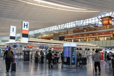 Tokyo, Japan- 19 May 2024: Interior view of the Haneda airport, Japan. Haneda Airport comprises three terminals serving domestic and international passengers clipart