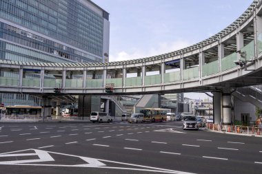 Shin Yokohama, Japan- 8 May 2024: Yokohama Kohoku junction with round overpass pedestrian walkway in Shin Yokohama, Japan clipart