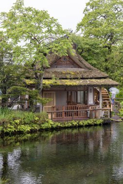 Kawaguchiko, Japan- 16 May 2024: Oshino Hakkai, a small village in the Fuji Five Lake region, located between Lake Kawaguchiko and Lake Yamanakako. clipart