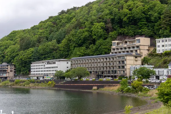 stock image Kawaguchiko, Japan-16 May 2024: House and apartment near Kawaguchiko lake in the peaceful morning, Japan