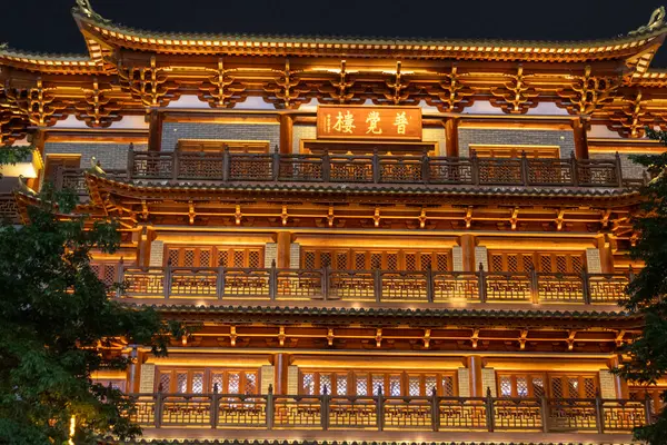 stock image Guangzhou, China- 6 Jun 2024: The Big Buddhist temple at night in Guangzhou, China. This temple has a history of more than one thousand years .