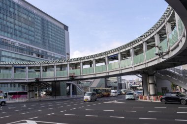 Shin Yokohama, Japan- 8 May 2024: Yokohama Kohoku junction with round overpass pedestrian walkway in Shin Yokohama, Japan clipart