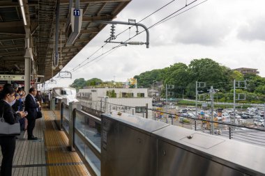 Shin Yokohama, Japan- 8 May, 2024: Shinkansen train is approaching to Shin Yokohama station, Japan. Shinkansen bullet trains are the fastest way to discover Japan. clipart