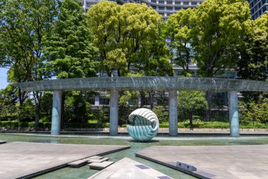 Tokyo, Japan- 11 May, 2024: Wadakura Fountain Park in Tokyo, Japan.  It was constructed to commemorate the royal wedding of the Emperor and Empress in 1961 clipart