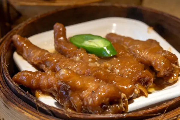 stock image Chicken feet dim sum in bamboo steamer Chinese cuisine