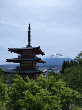 Shimoyoshida, Japan- 15 May 2024: View of mount Fuji with Chureito Pagoda at Arakurayama Sengen Park mountain in Japan clipart