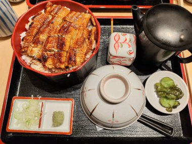 Hitsumabushi is a Japanese Nagoya rice dish decorated with grilled Unagi eel at the top. The eel is served in smaller pieces that allows it to be enjoyed with three ways. clipart