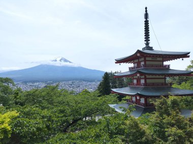 Shimoyoshida, Japan- 15 May 2024: View of mount Fuji with Chureito Pagoda at Arakurayama Sengen Park mountain in Japan clipart