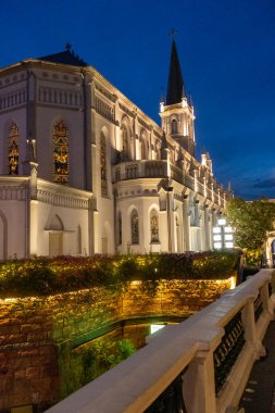 Singapore- 8 Oct 2024: Night view of Chijmes Church in the central area of Singapore. It is a heritage building and an example of colonial architecture in the tropics. clipart