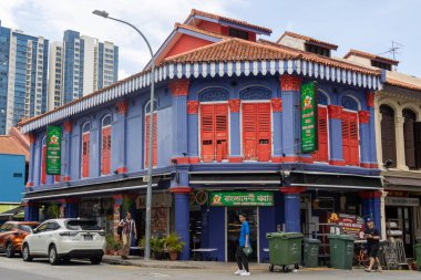 Singapore -11 Oct 2024: Colonial colorful houses with small shops in Little India in Singapore. Little India is an ethnic neighbourhood found in Singapore that has Tamil cultural elements and aspects. clipart