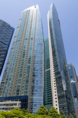 Singapore- 27 Oct 2024: View of The Sail building in Marina Bay, a stunning architectural landmark set against Singapore's iconic skyline. clipart