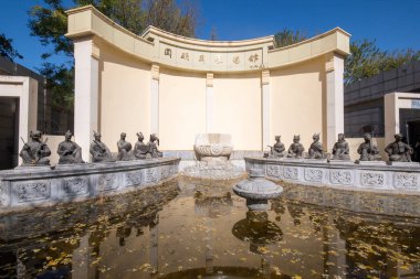 Beijing, China- 3 Nov 2024: Replicas of 12 animal zodiac sculptures in Yuanmingyuan park in Beijing. The origin sculptures were part of the grand fountain within the Yuanmingyuan clipart