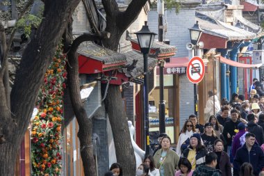 Beijing, China-12 Nov 2024: View of Nanluoguxiang in Beijing, China. It is the most popular and one of the oldest Hutongs in Beijing with a history of more than 740 years clipart